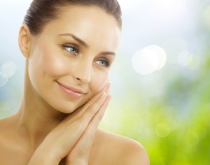 Beautiful Healthy Woman touching her skin